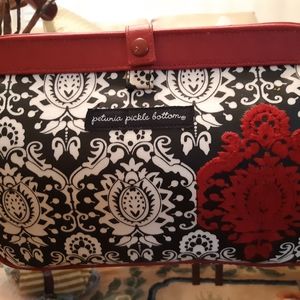 Clutch with diaper changing pad